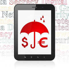 Image showing Safety concept: Tablet Computer with Money And Umbrella on display