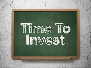 Image showing Time concept: Time To Invest on chalkboard background