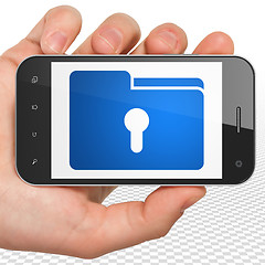 Image showing Business concept: Hand Holding Smartphone with Folder With Keyhole on display