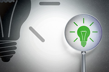 Image showing Finance concept:  Light Bulb with optical glass on digital background