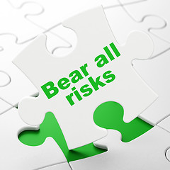 Image showing Insurance concept: Bear All Risks on puzzle background
