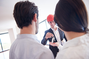 Image showing couple buying new home with real estate agent