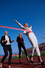 Image showing business people running on racing track