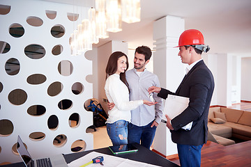 Image showing couple buying new home with real estate agent