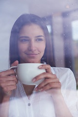 Image showing beautiful young woman drink first morning coffee