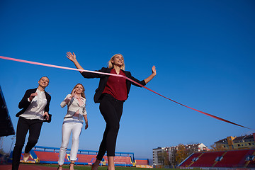 Image showing business people running on racing track