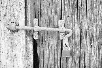 Image showing europe old in  italy  antique close brown door and rusty lock  c