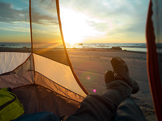 Image showing Resting on sea after hiking 