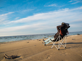 Image showing woman sitting on beach