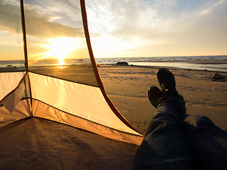 Image showing Resting on sea after hiking 