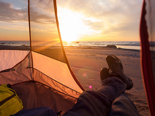 Image showing Resting on sea after hiking 