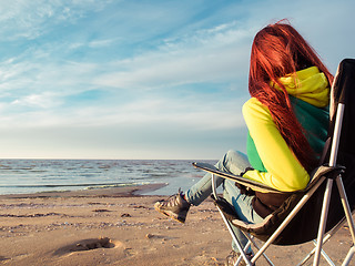 Image showing woman sitting on deckchair