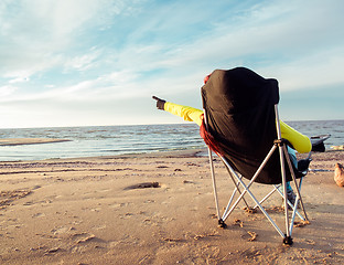 Image showing woman sitting on beach