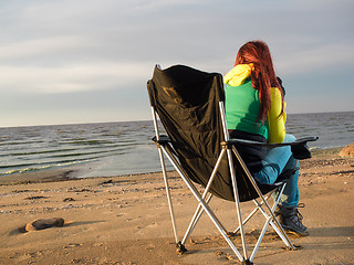 Image showing woman sitting on beach