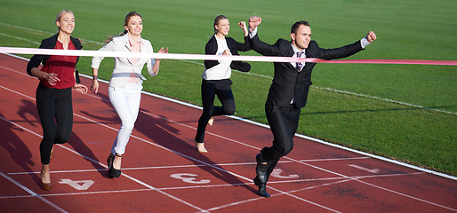 Image showing business people running on racing track