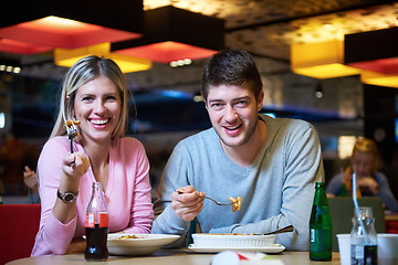 Image showing couple having lunch break in shopping mall