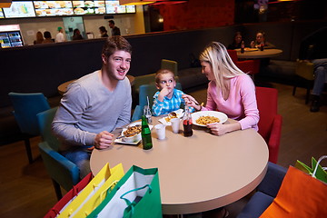 Image showing family having lunch in shopping mall