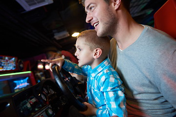 Image showing father and son playing game in playground