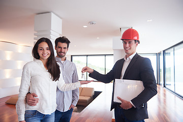 Image showing couple buying new home with real estate agent