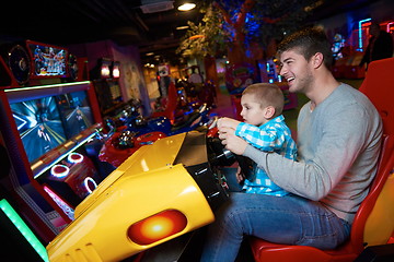 Image showing father and son playing game in playground