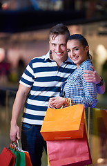 Image showing young couple with shipping bags