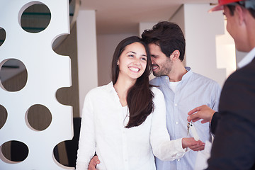 Image showing couple buying new home with real estate agent