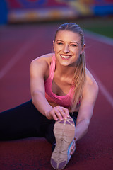 Image showing sporty woman on athletic race track