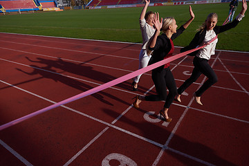 Image showing business people running on racing track