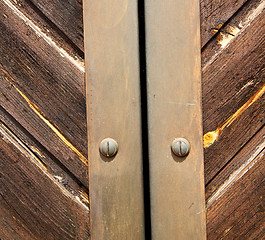 Image showing stripped paint  door    in italy   ancian wood and traditional  