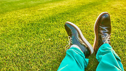 Image showing Man relaxing, enjoying landscape on sunny day - point of view