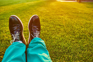 Image showing Man relaxing, enjoying landscape on sunny day - point of view