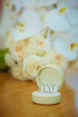 Image showing wedding bouquet and rings