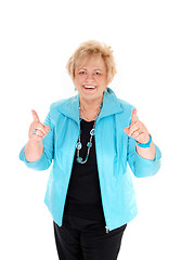 Image showing Happy mature woman with thumbs up.