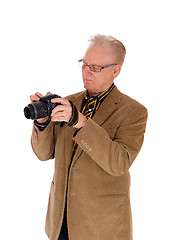 Image showing Middle age man taking pictures.