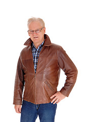 Image showing Mature man in leather jacket standing.