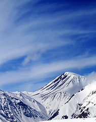 Image showing Winter snowy mountains in sun windy day