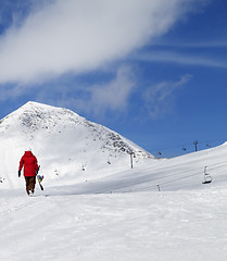 Image showing Snowboarder on slope at sun nice day