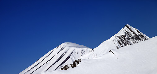 Image showing Panoramic view on off-piste slope and blue clear sky in nice day