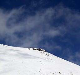 Image showing Off-piste slope with stones at windy day