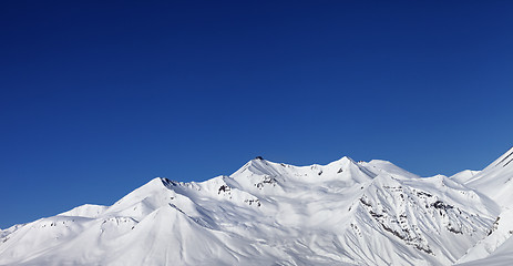 Image showing Panoramic view on snowy mountains at sun day