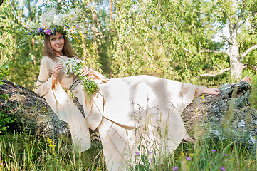 Image showing Beatiful woman in national dress and flower wreath