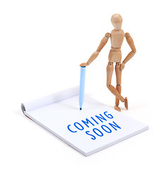 Image showing Wooden mannequin writing - Coming soon