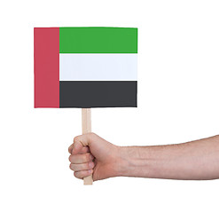 Image showing Hand holding small card - Flag of Sudan