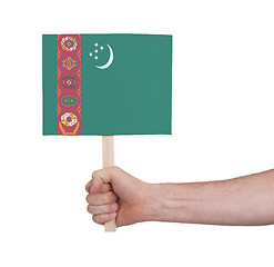 Image showing Hand holding small card - Flag of Turkmenistan