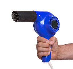 Image showing Old blue hairdryer in hand