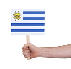 Image showing Hand holding small card - Flag of Uruguay