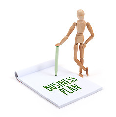 Image showing Wooden mannequin writing - Business plan