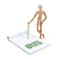 Image showing Wooden mannequin writing - Advertise