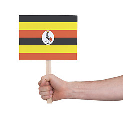 Image showing Hand holding small card - Flag of Uganda