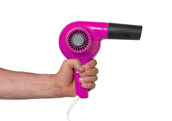 Image showing Old pink hairdryer in hand